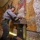 Radar specialist Hirokatsu Watanabe using his specially modified Koden-brand radar scanning machine. Image: Brandon Quilicci, National Geographic